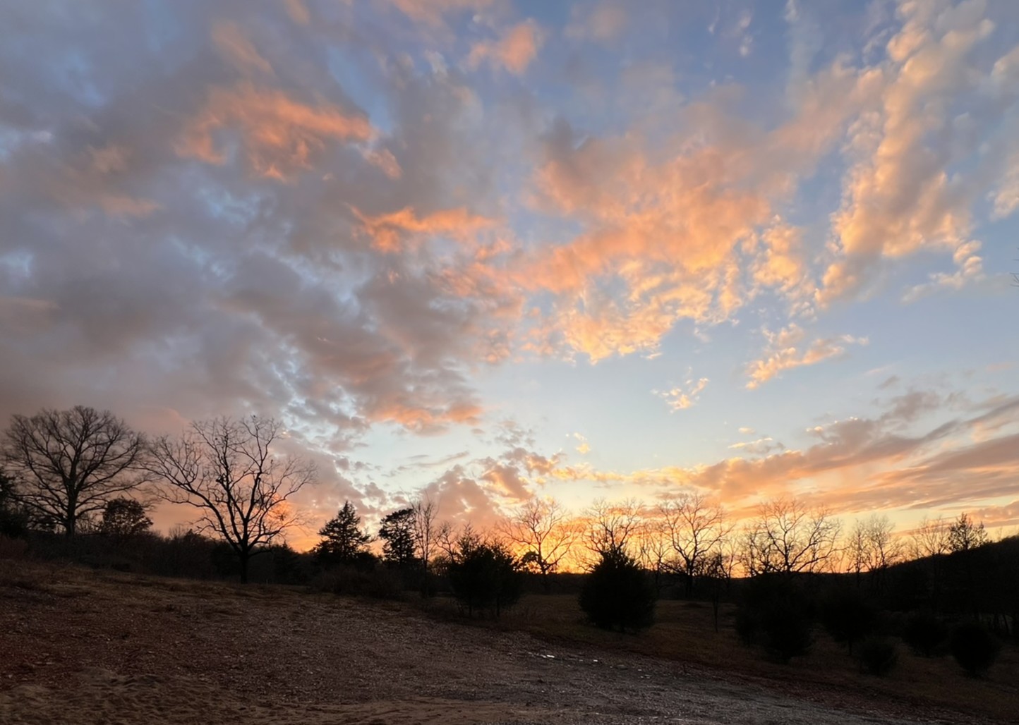 Serene clouds at sunset captioned Serenity
